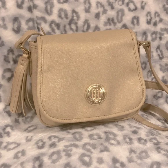 Has a tassel decoration and an adjustable strap. - Picture 1 of 3